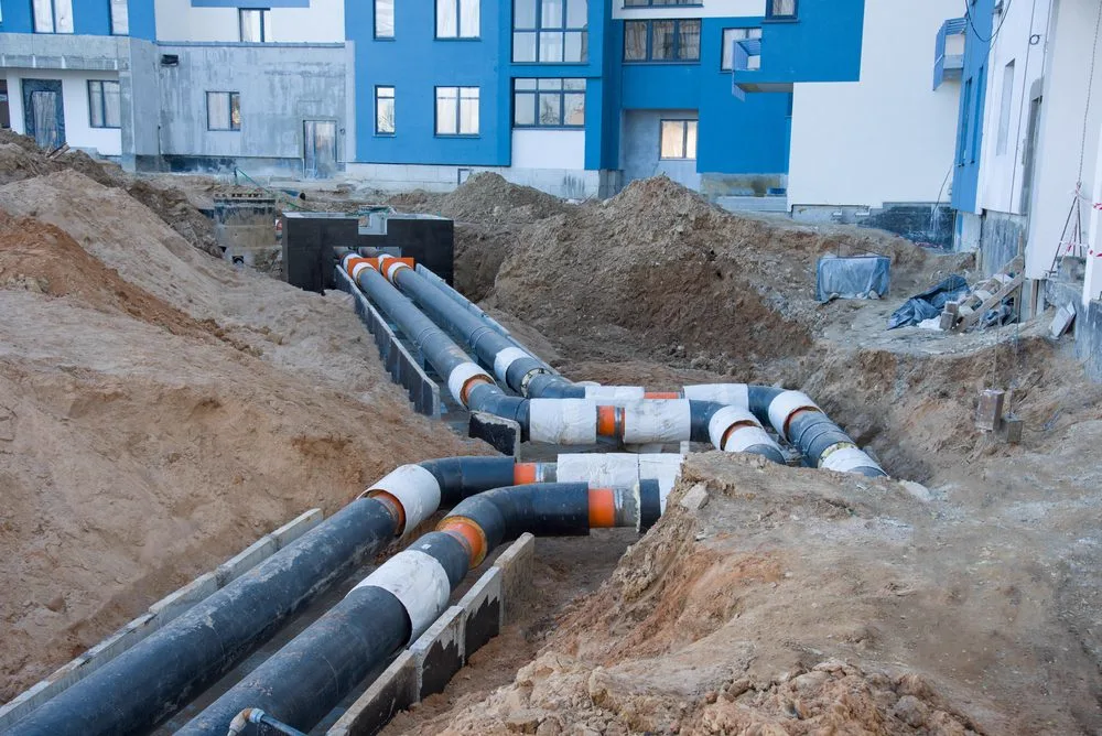 New upgraded drainage pipework laid in a trench at a Brisbane property