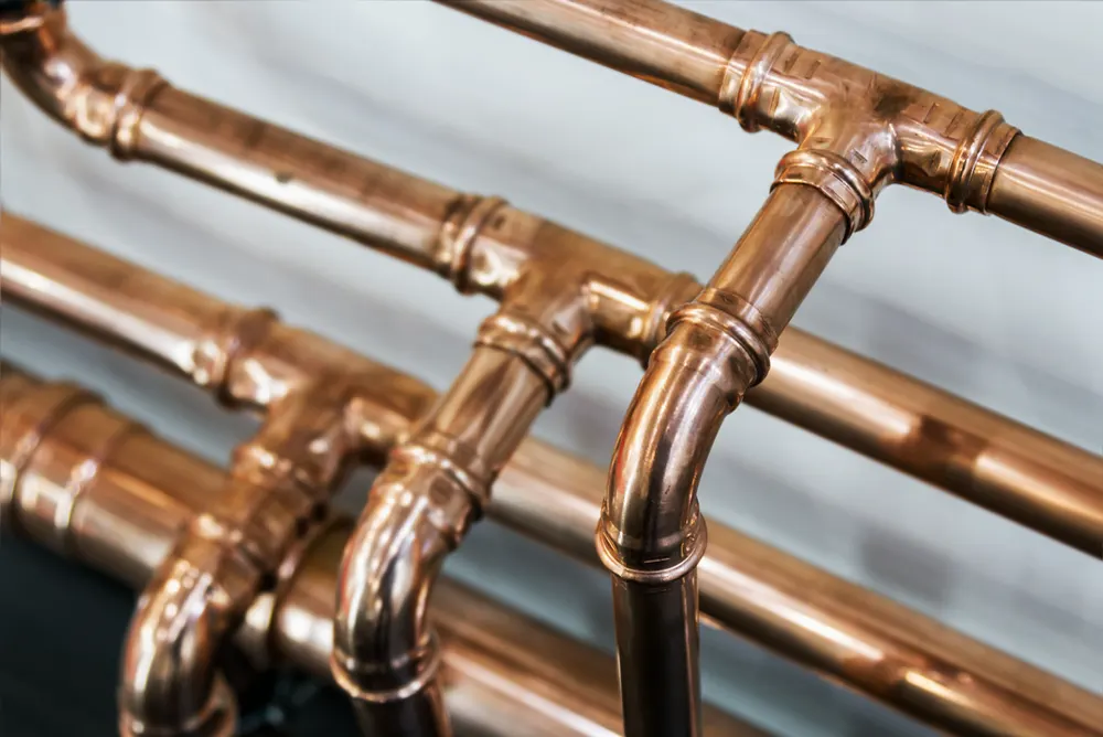 Copper and drainage pipework running through a Brisbane property wall cavity