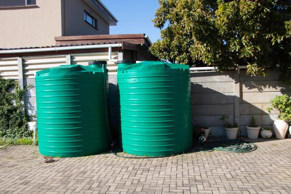 Onsite septic and holding tanks installed beside a residential property